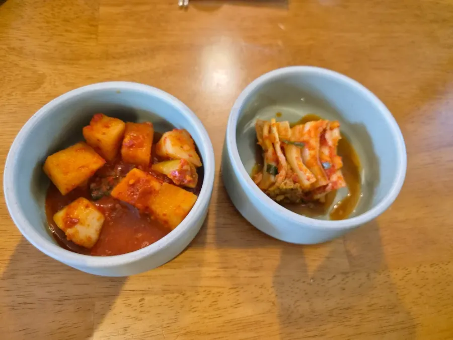 Two kinds of kimchi on the table at Doonjeong