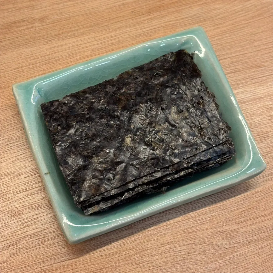Soy sauce and gopchang gim served with mackerel gondre rice