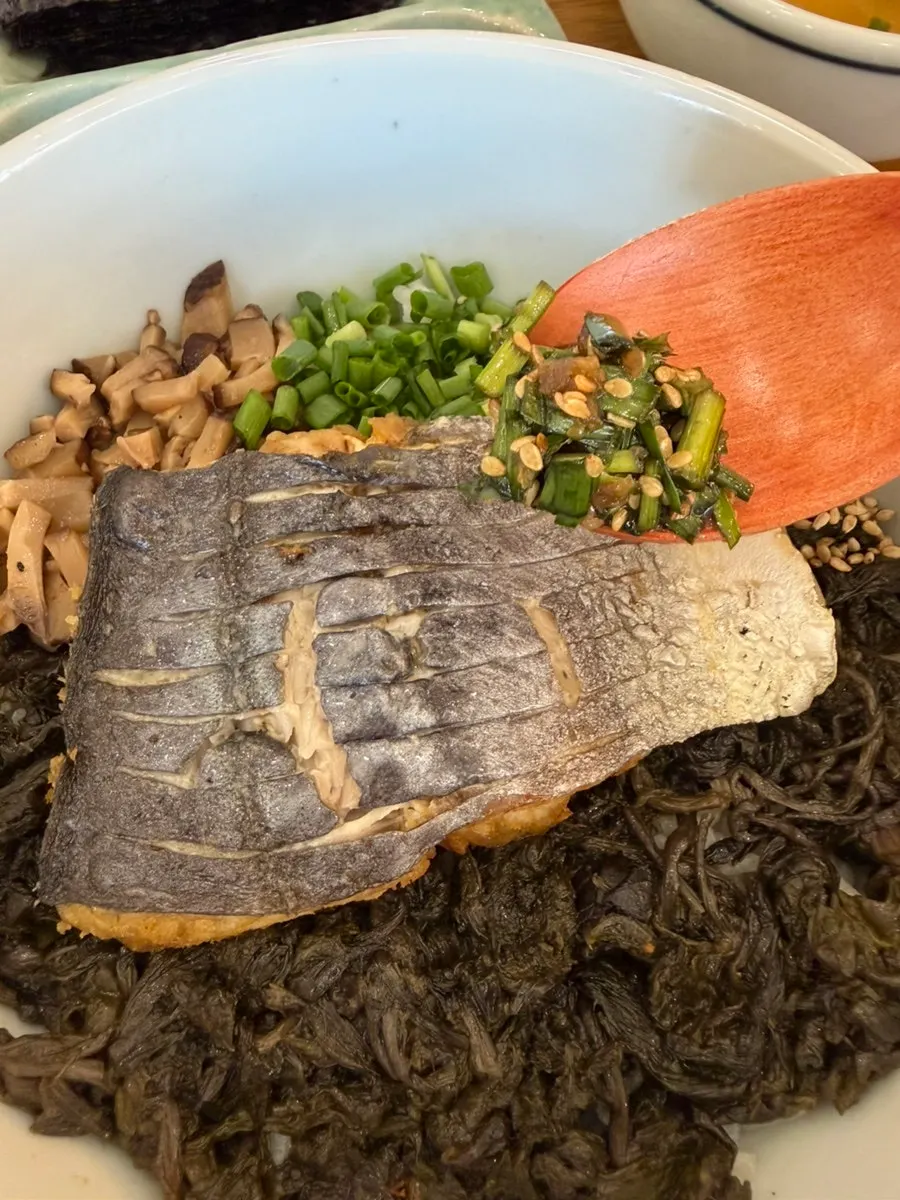 A spoonful of mackerel gondre rice with sauce