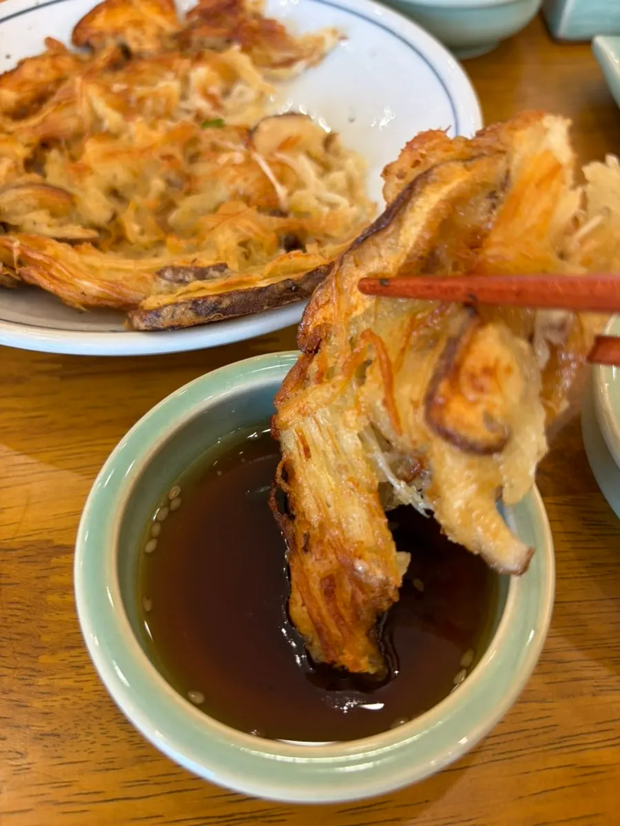 Mushroom platter dipped in accompanying sauce