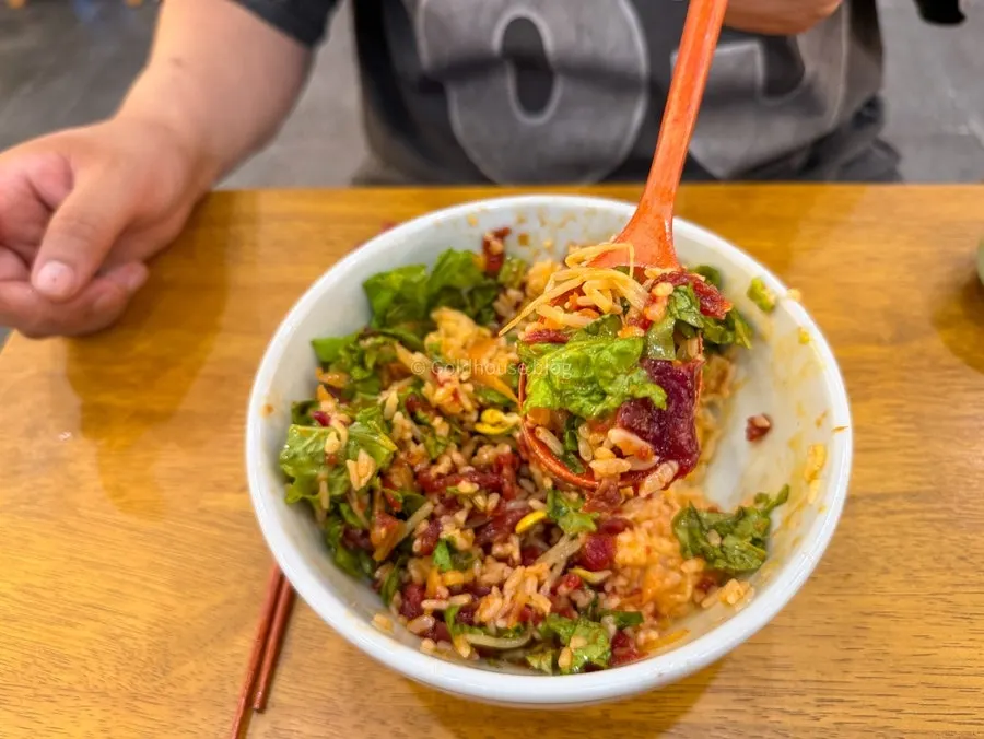 A spoonful of yukhoe bibimbap lifted up