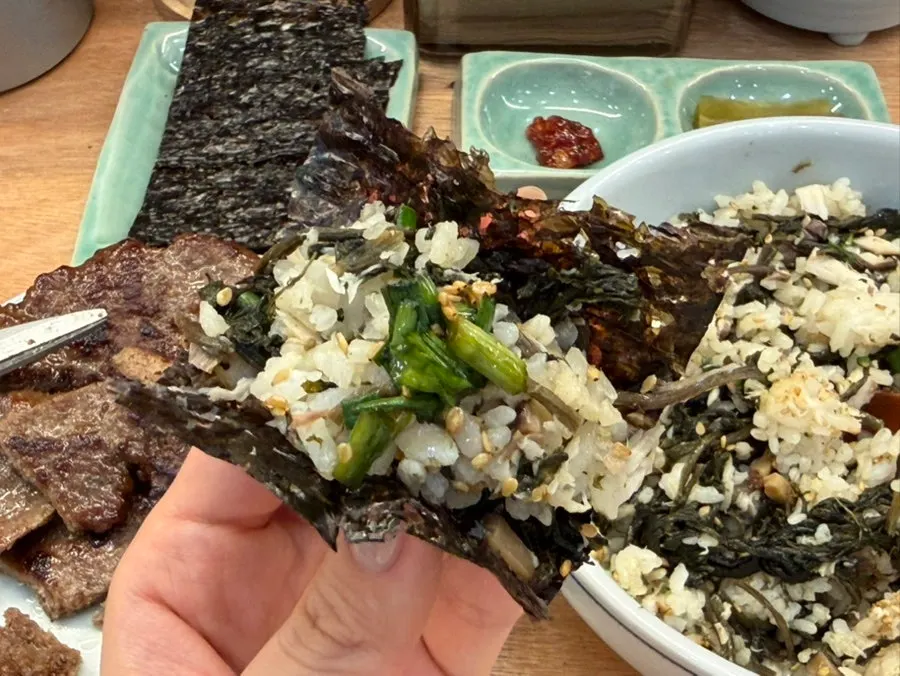 A bite of mackerel gondre rice wrapped in plain gim