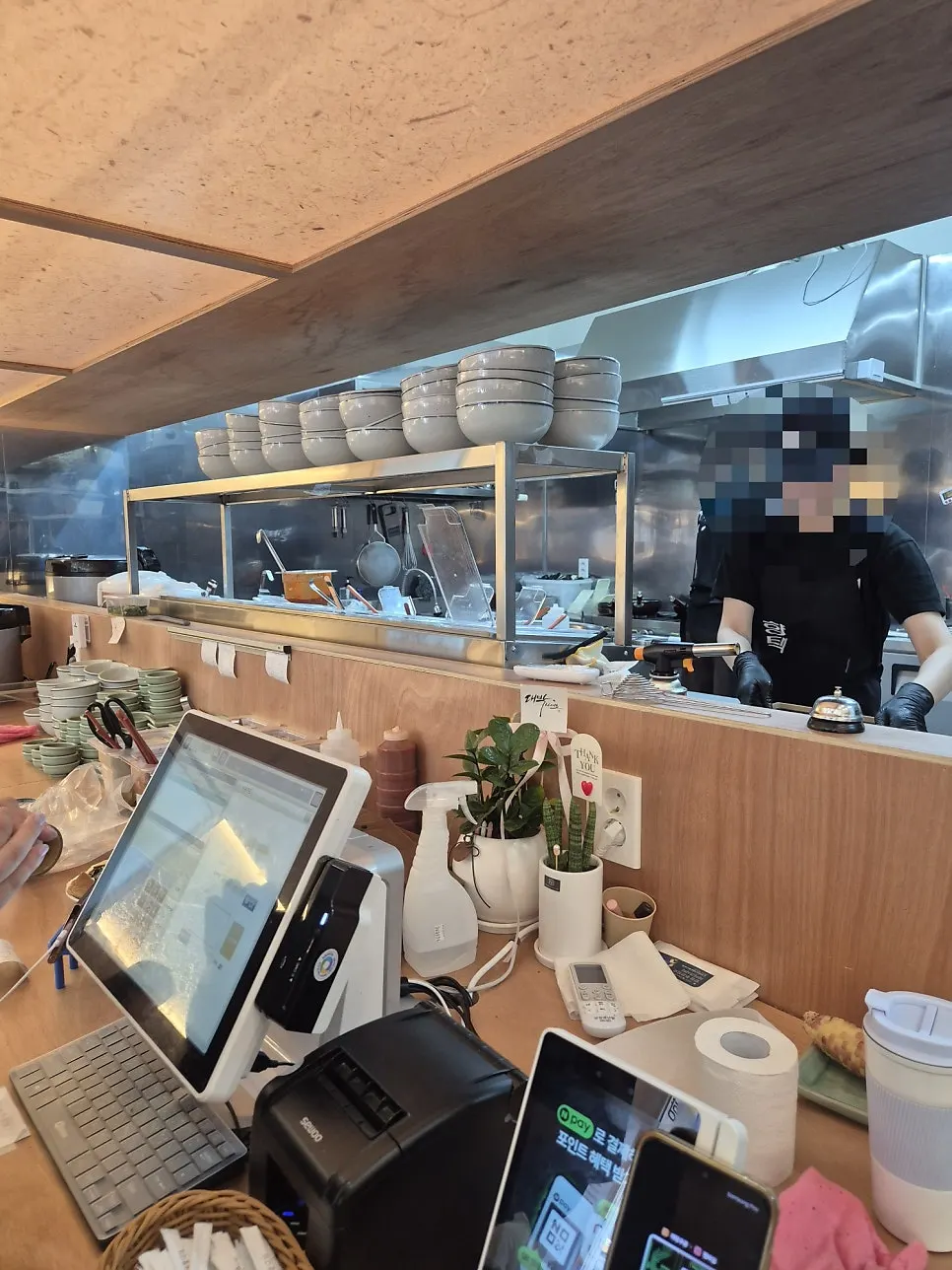 Open kitchen where food preparation is visible
