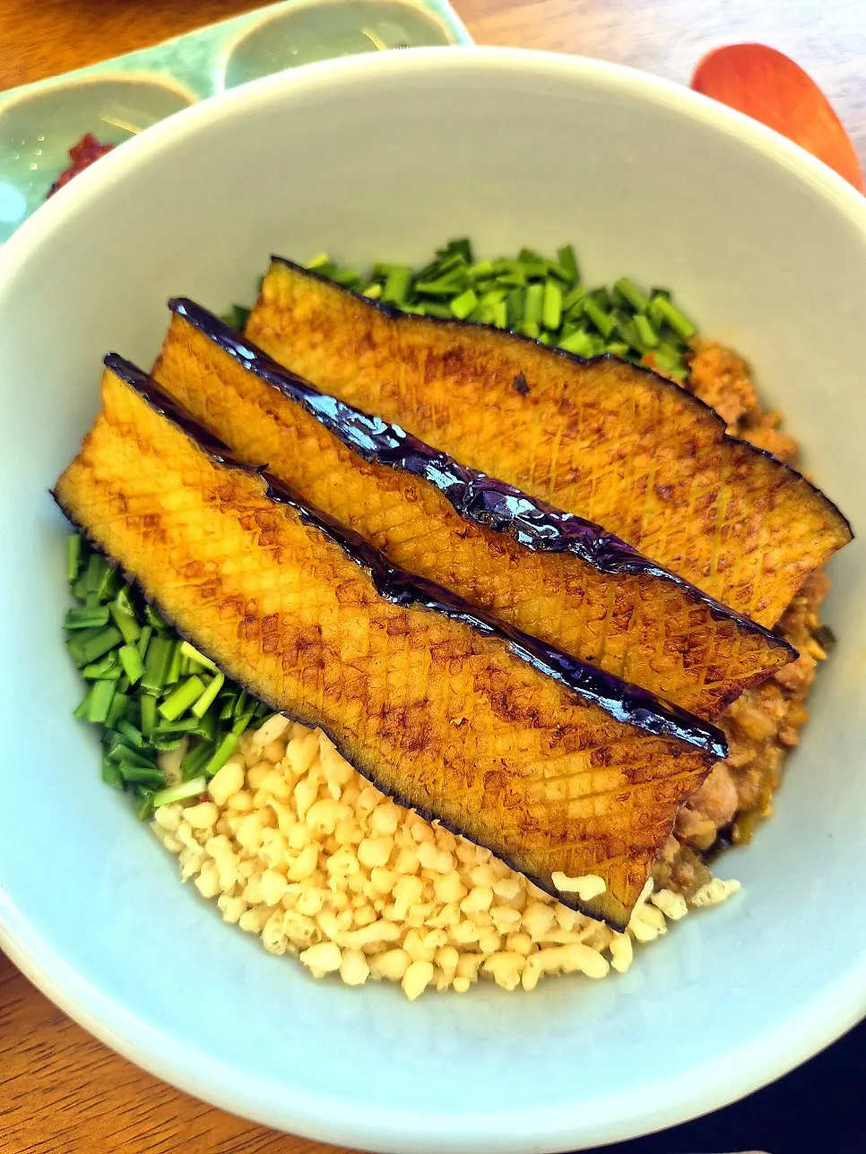 Full table setting of eggplant doenjang rice bowl