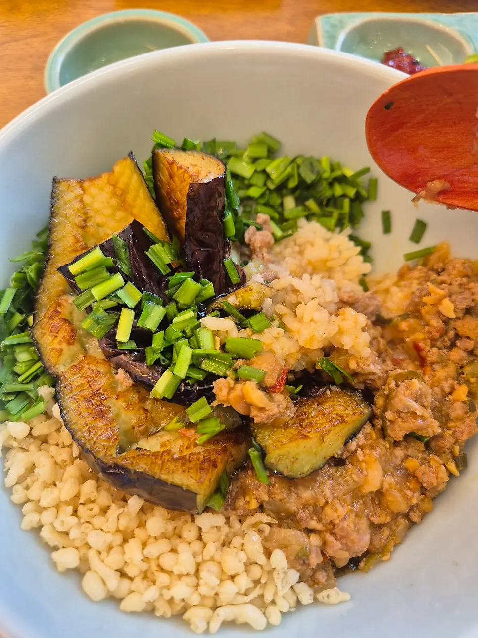 Softly cooked eggplant on top of doenjang rice bowl