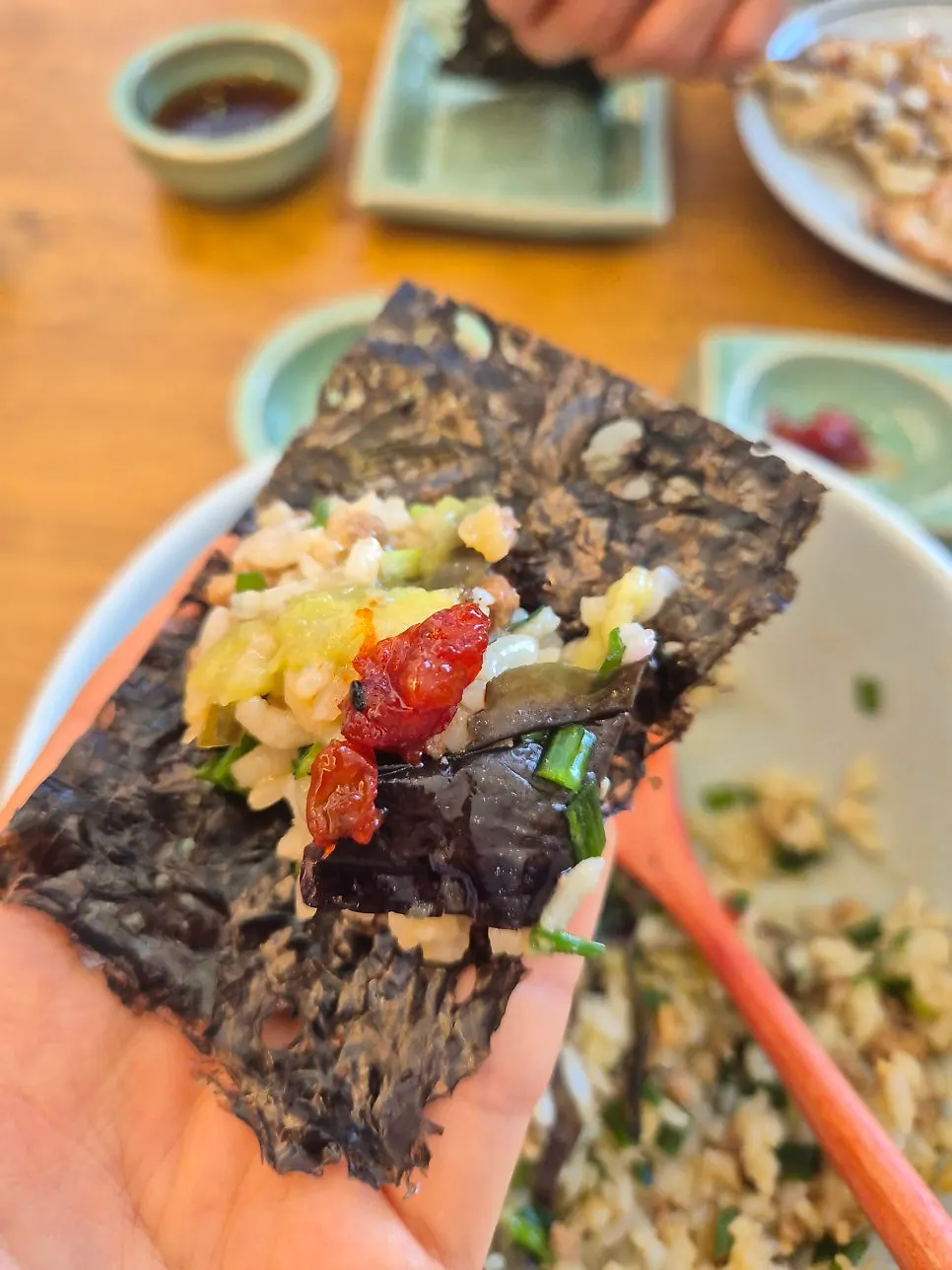 Rice and bibim jeotgal placed on gopchang gim