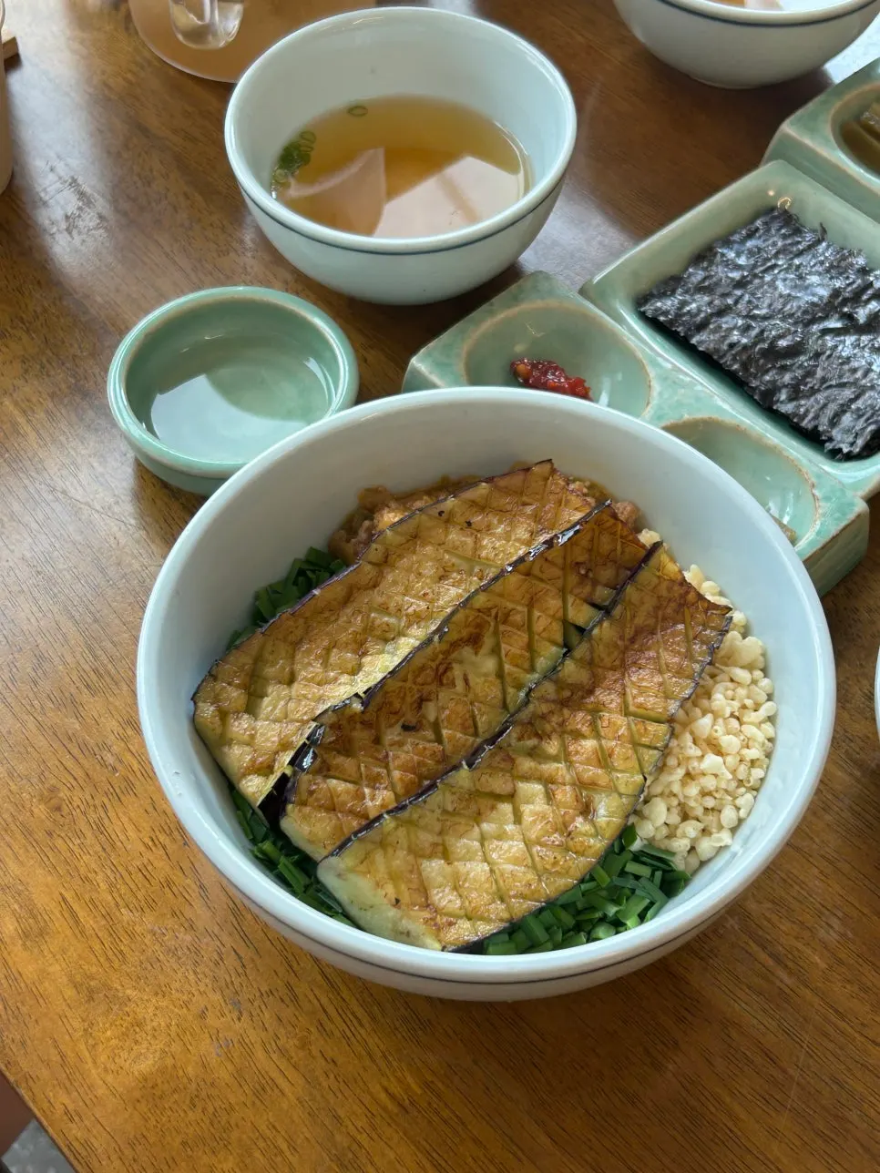 Eggplant doenjang rice bowl topped with grilled eggplant and strong doenjang sauce