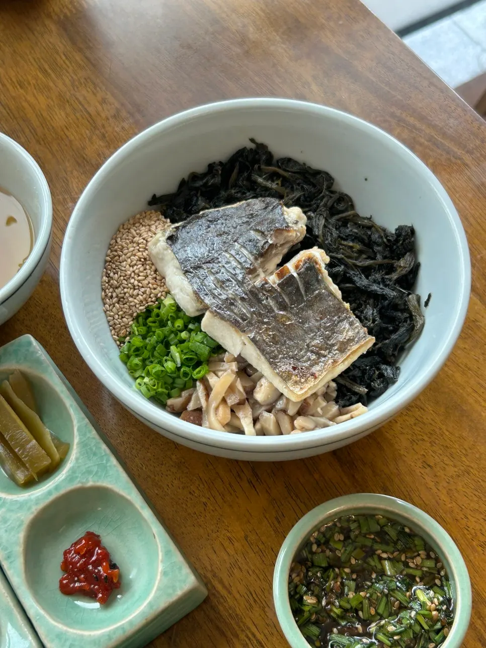 Mackerel gondre rice topped with gondre greens and grilled mackerel
