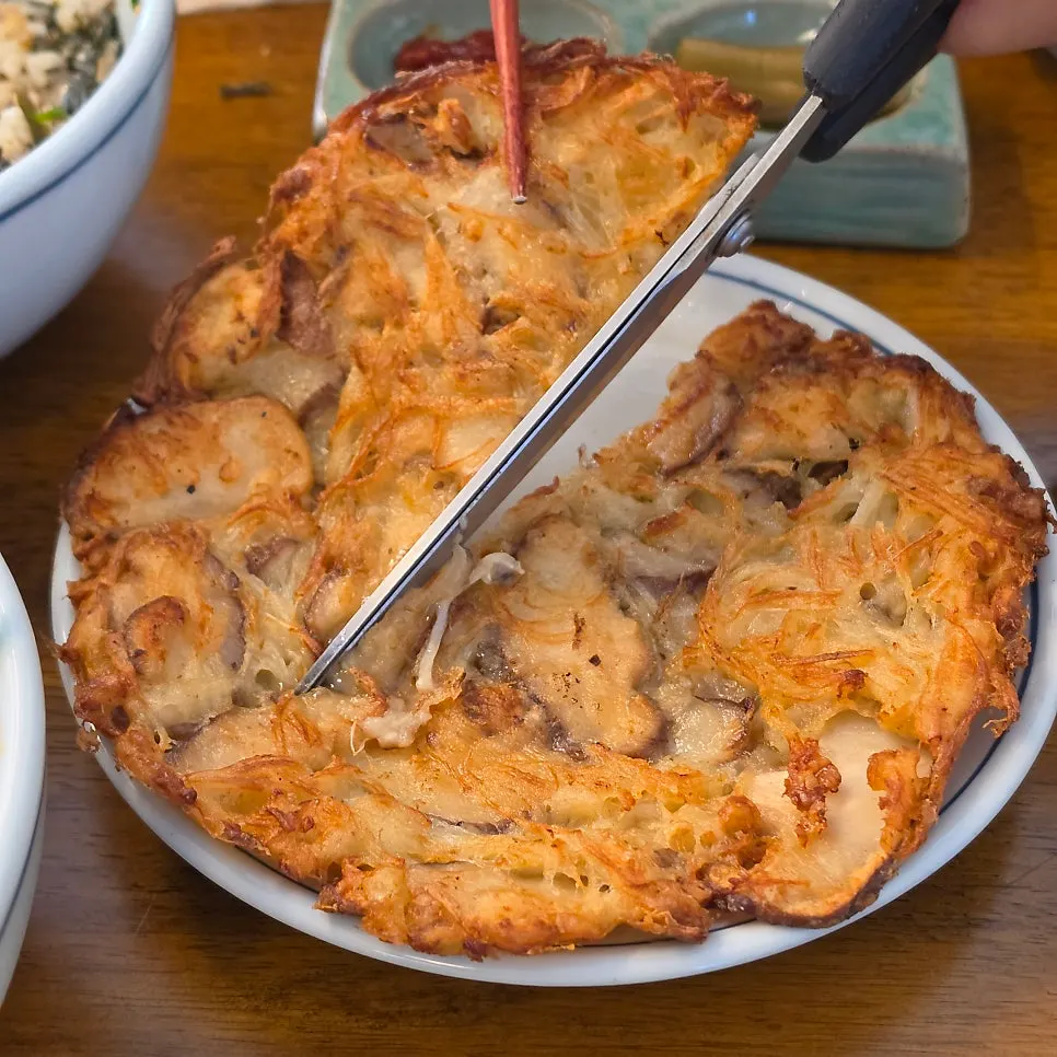 A plate of crisply fried mushroom pancake