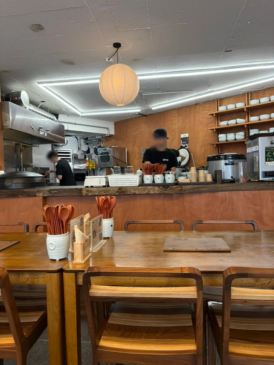 Restaurant interior with open kitchen visible