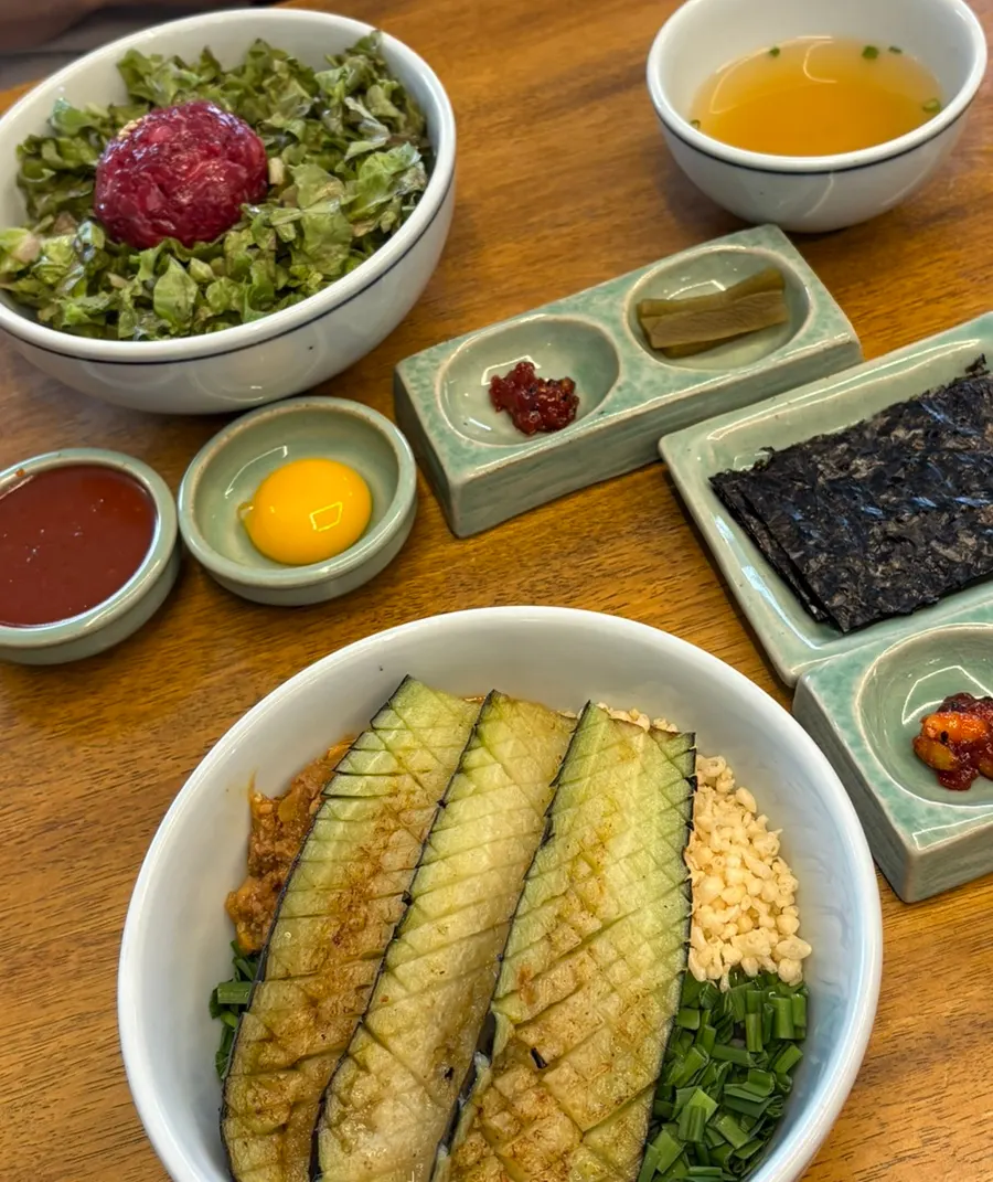 Neatly plated rice bowls and side dish