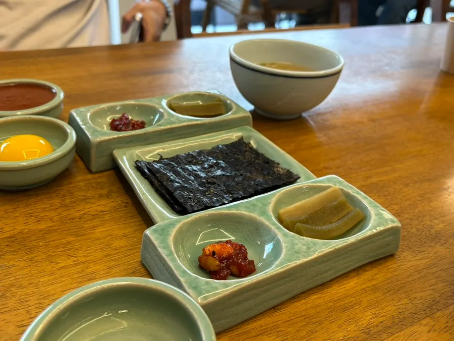 Basic banchan including gomchang gim and mixed jeotgal