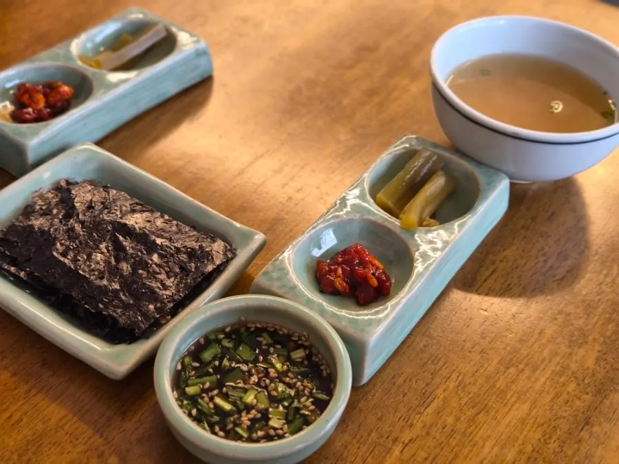 Basic side dishes and broth set on the table