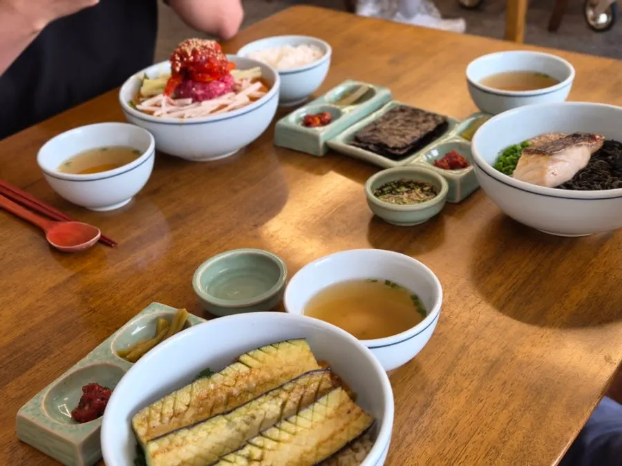 Table setting with seafood jeotgal, pickled gungchae, and gopchang gim