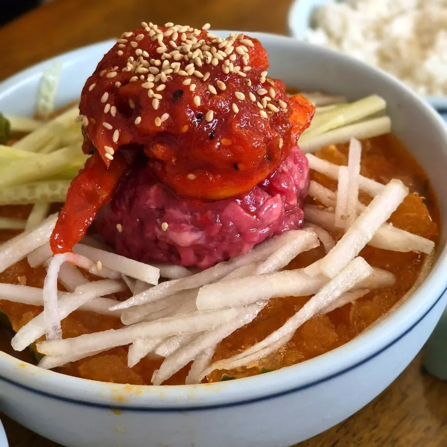 Pollock mulhoe yukhoe topped with raw beef and raw pollock