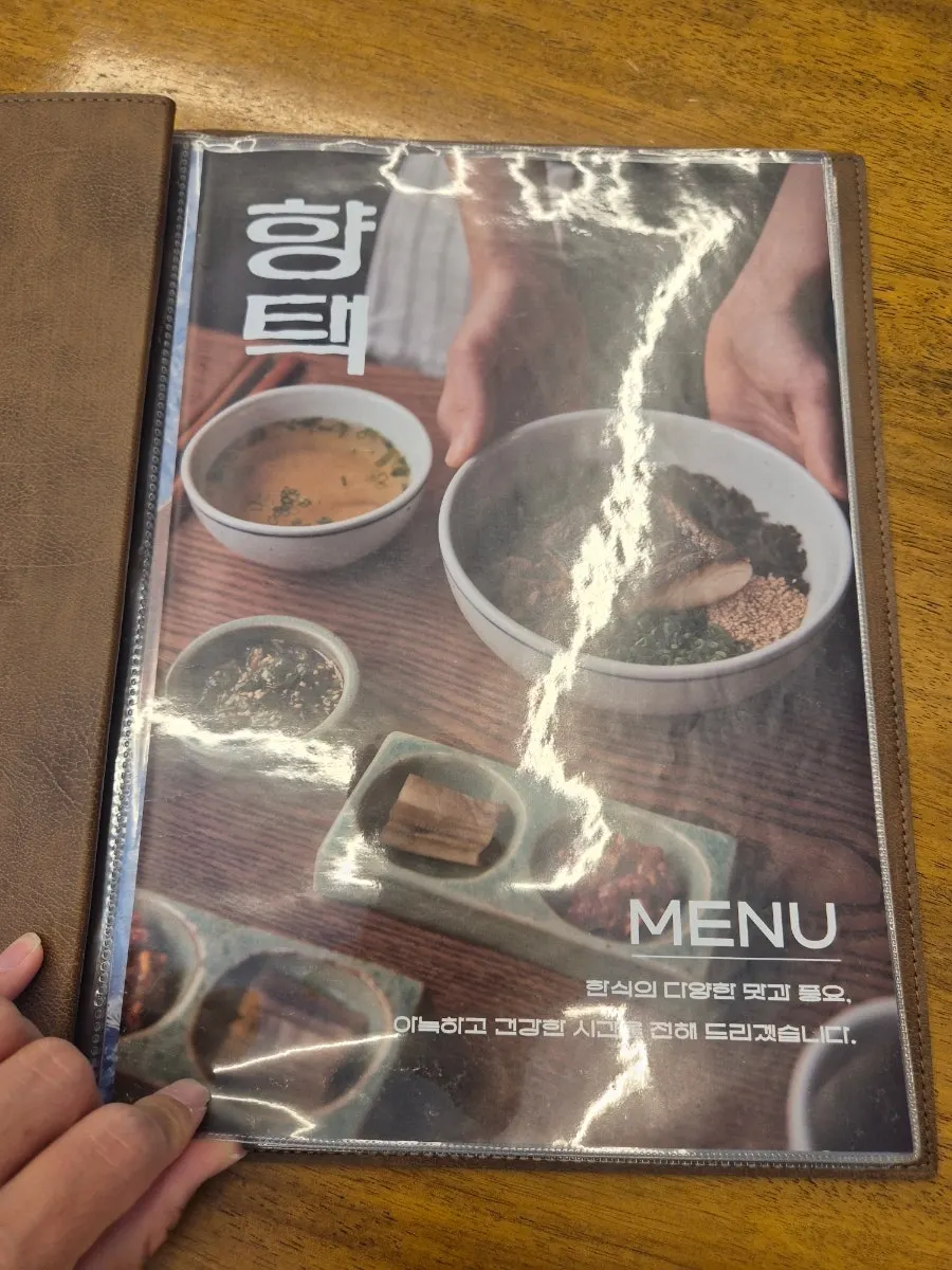 Menu board posted outside Hyangtaek Daebong Branch
