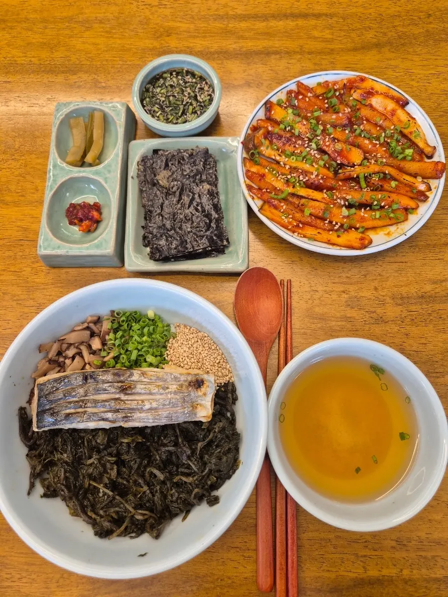 Grilled mackerel served over gondre herb rice