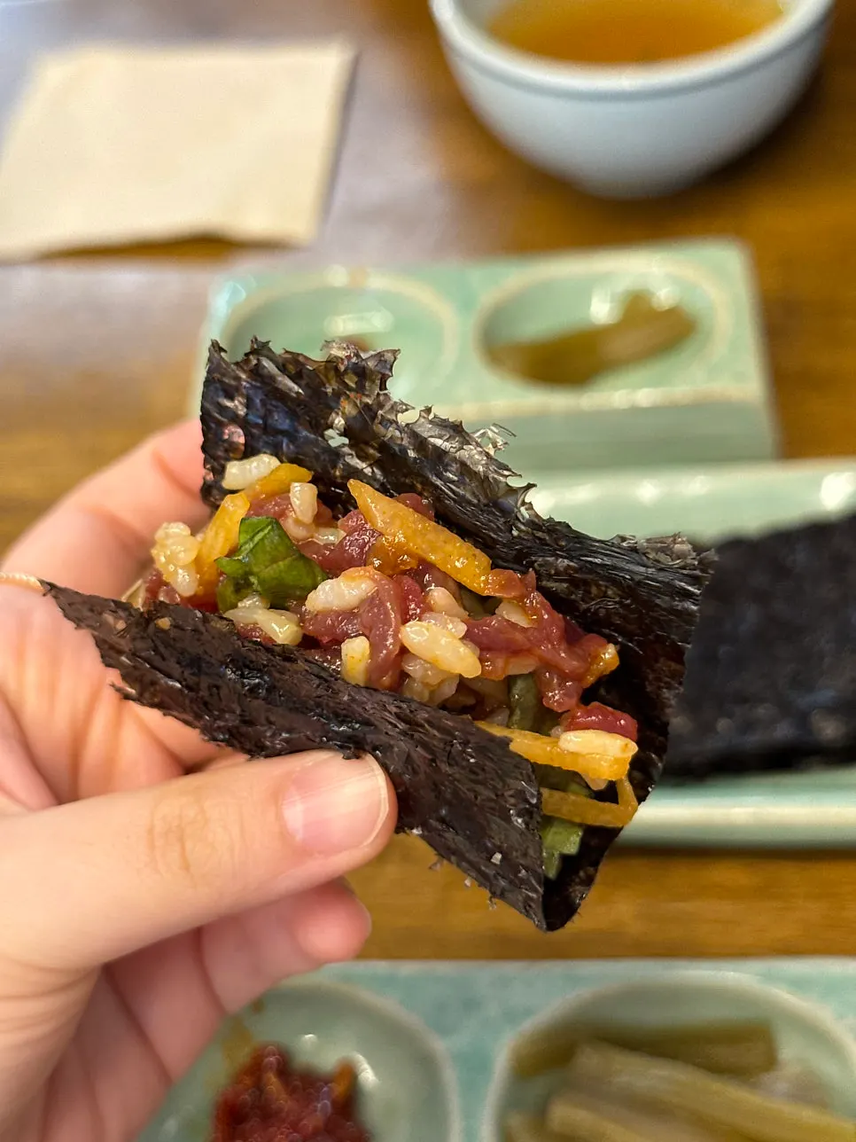 A spoonful of bibimbap piled high with raw beef