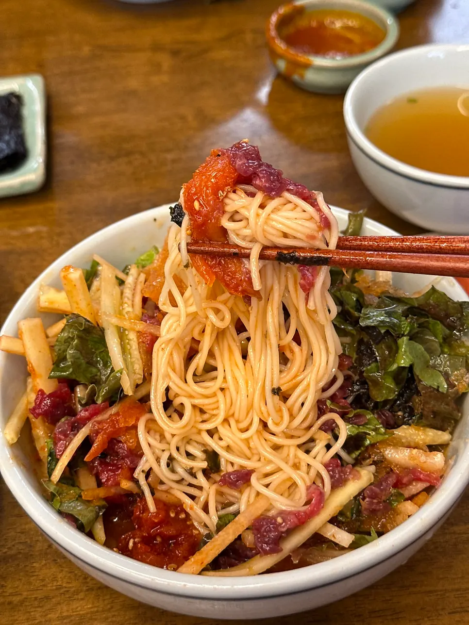 Icy broth and bouncy noodles in the mulhoe