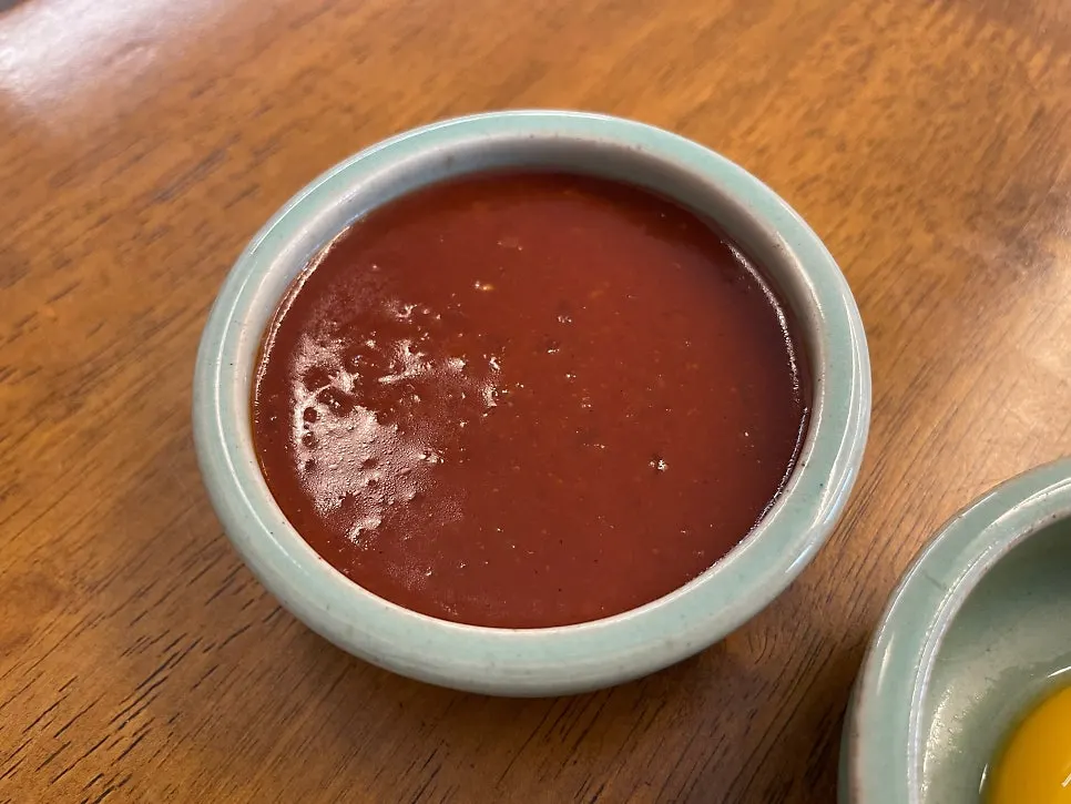 Soup and side dishes on the table at Hyangtaek Daebong Branch