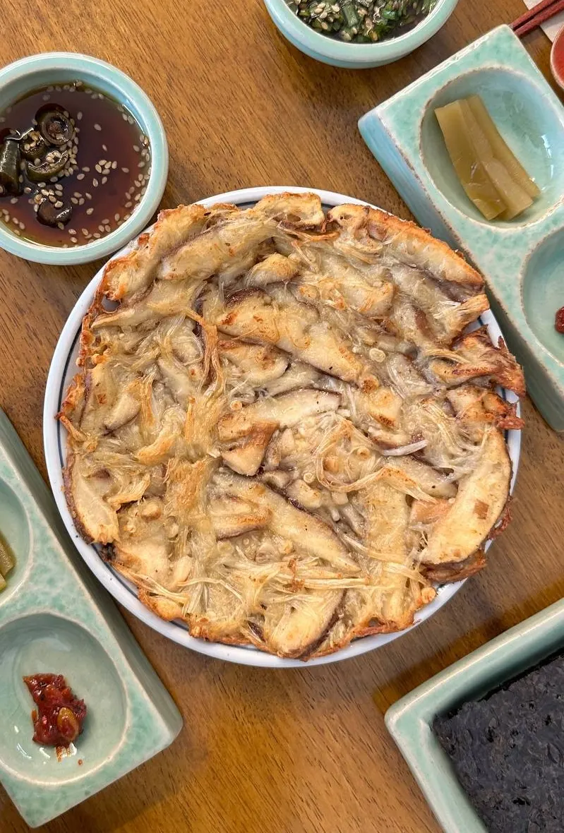 Mushroom pancake served with soy sauce