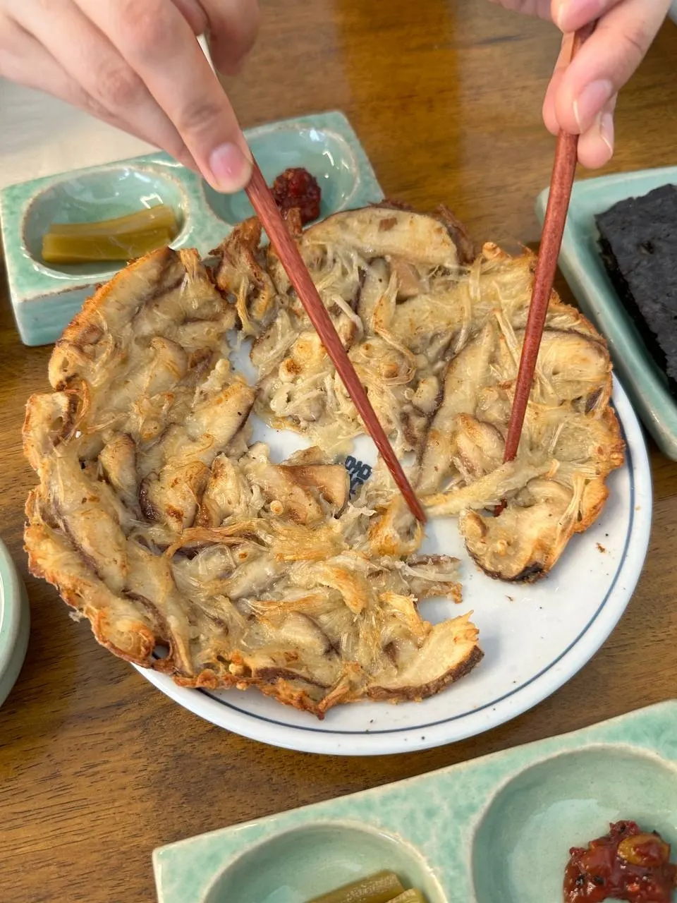 Table setting with rice and mushroom pancake