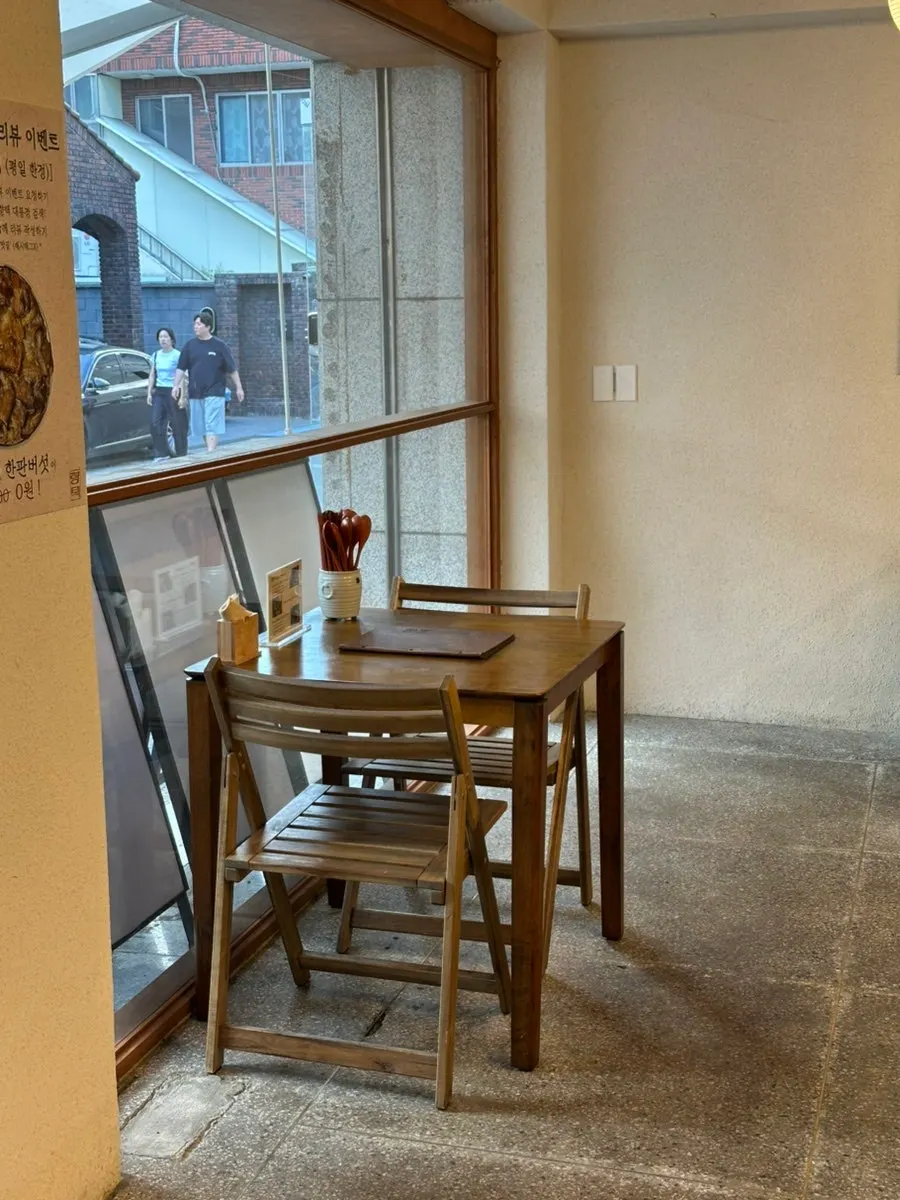 Seating inside the restaurant with a wood-toned interior