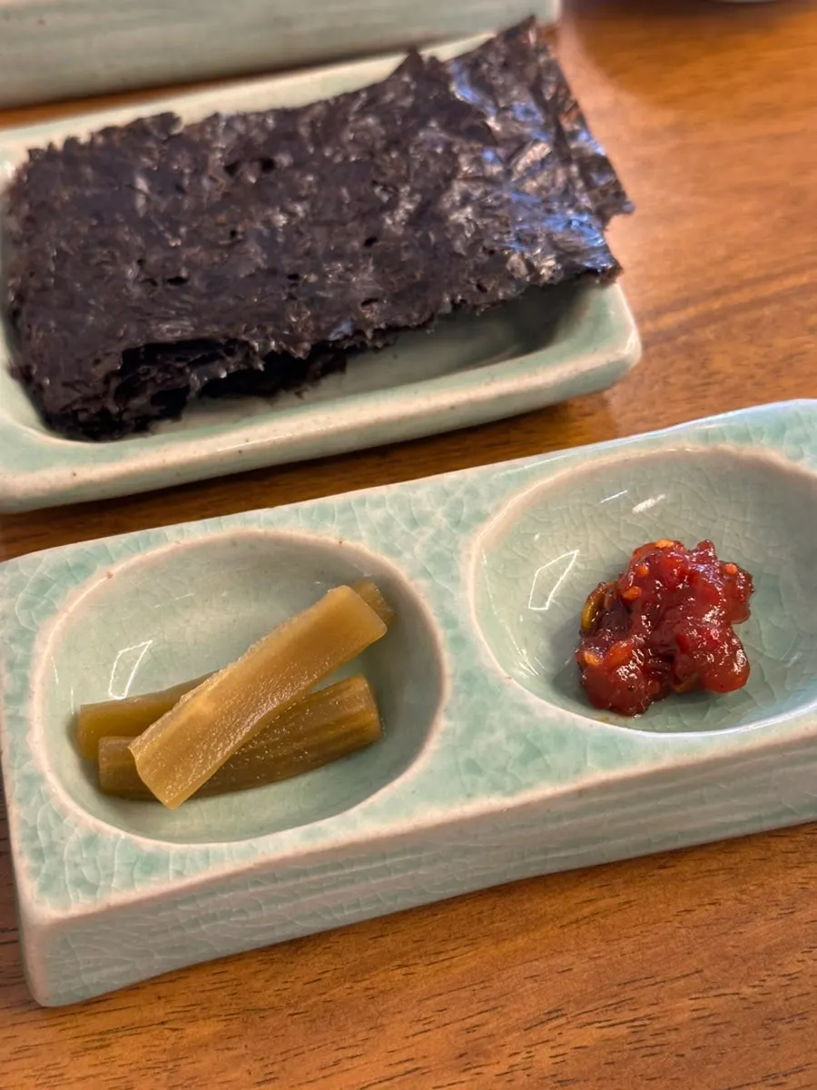 Plate of seasoned jeotgal and roasted gim among the side dishes