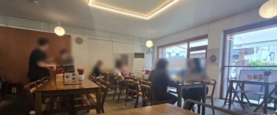 Wood-toned dining hall of Hyangtaek Daebong Branch