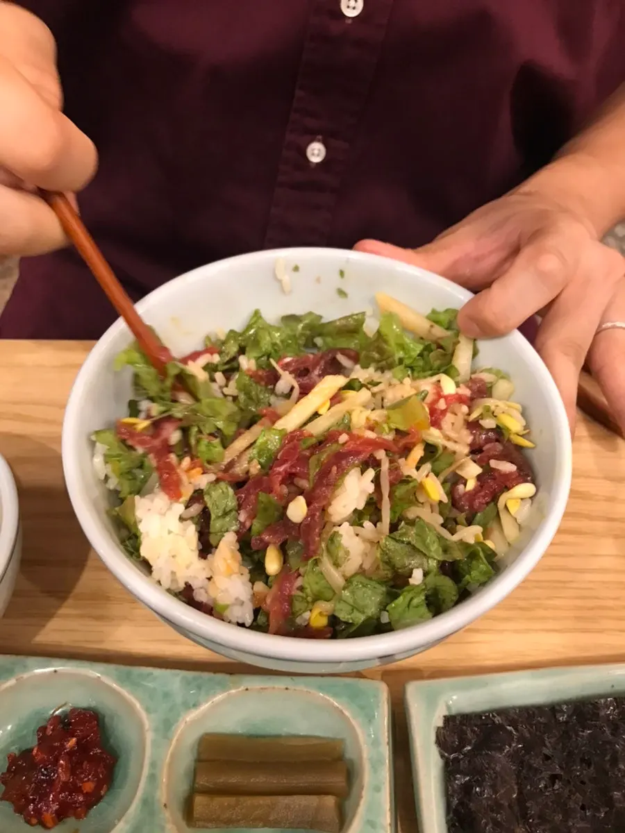 Yukhoe bibimbap mixed with egg yolk