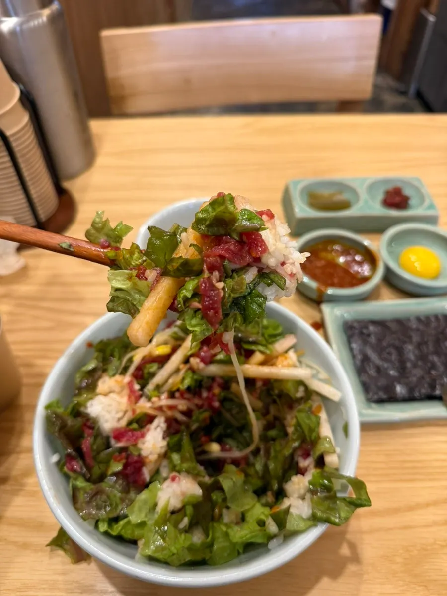 A spoonful of yukhoe bibimbap