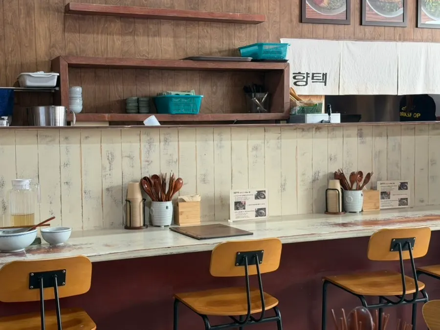 Interior of Hyangtaek's main branch with wood-toned decor