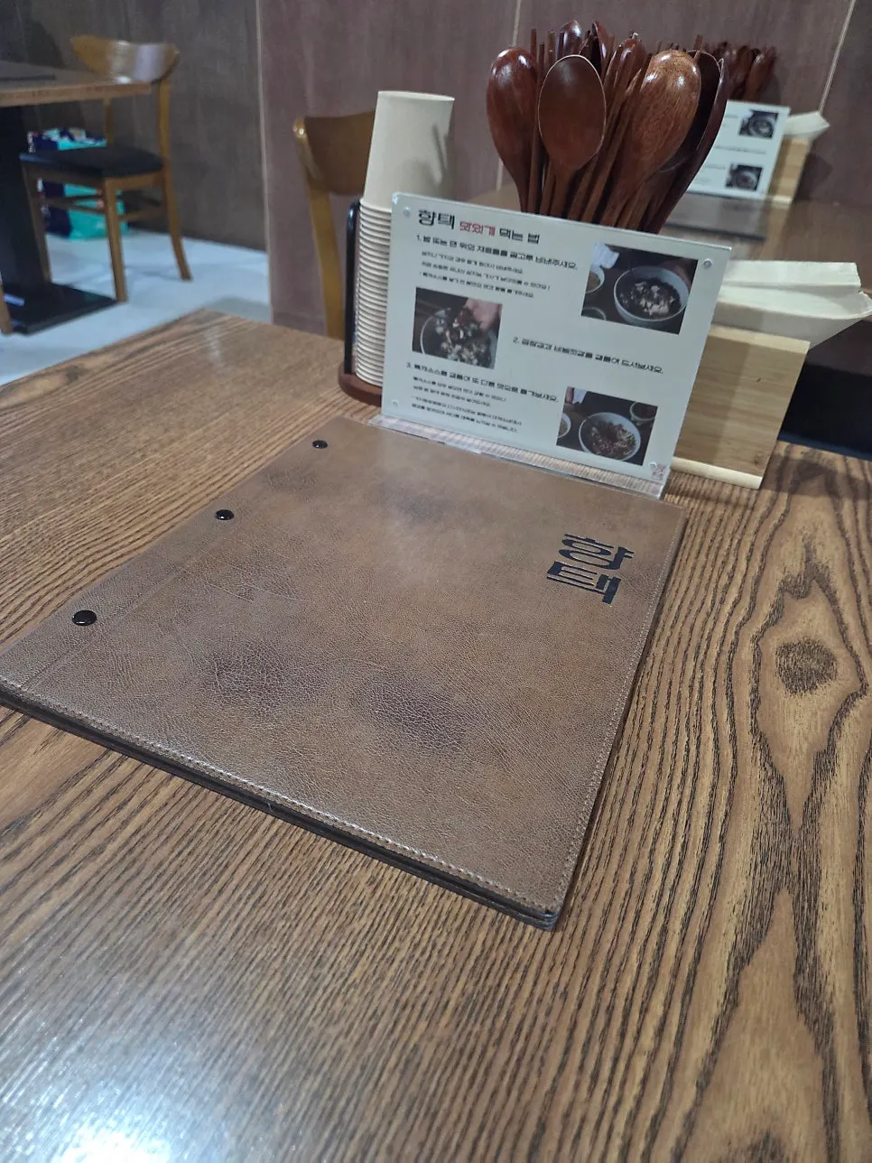 Table set with utensils and menu