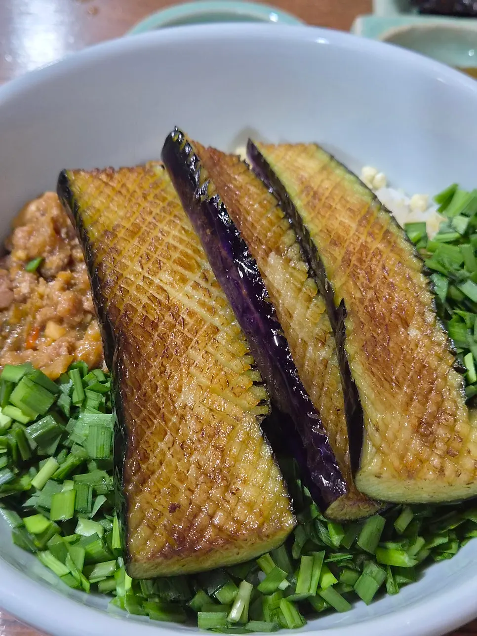 Gaji doenjang deopbap topped with scored, grilled eggplant