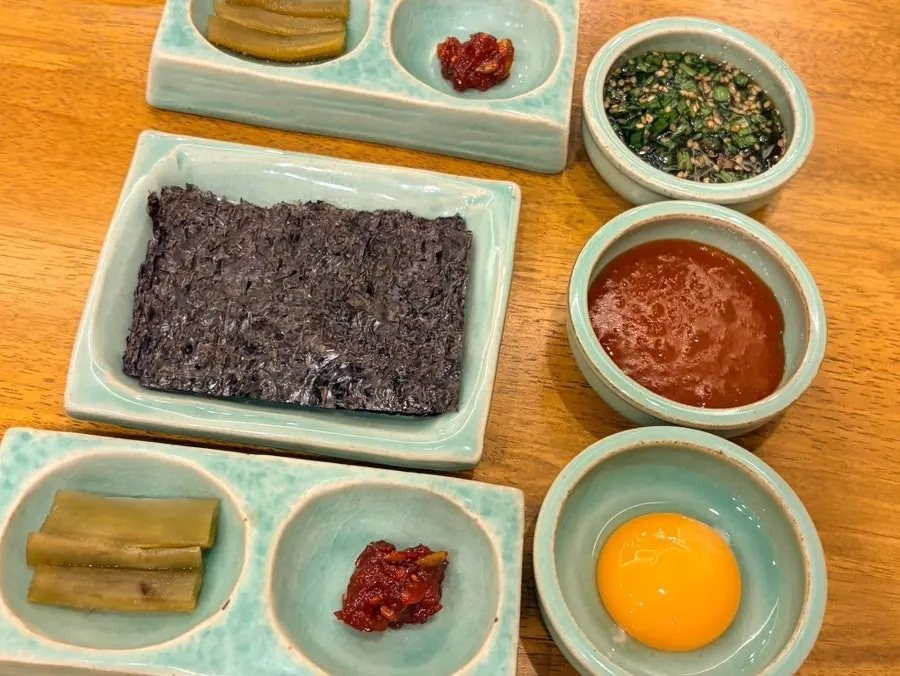Water cups and utensils set before the meal