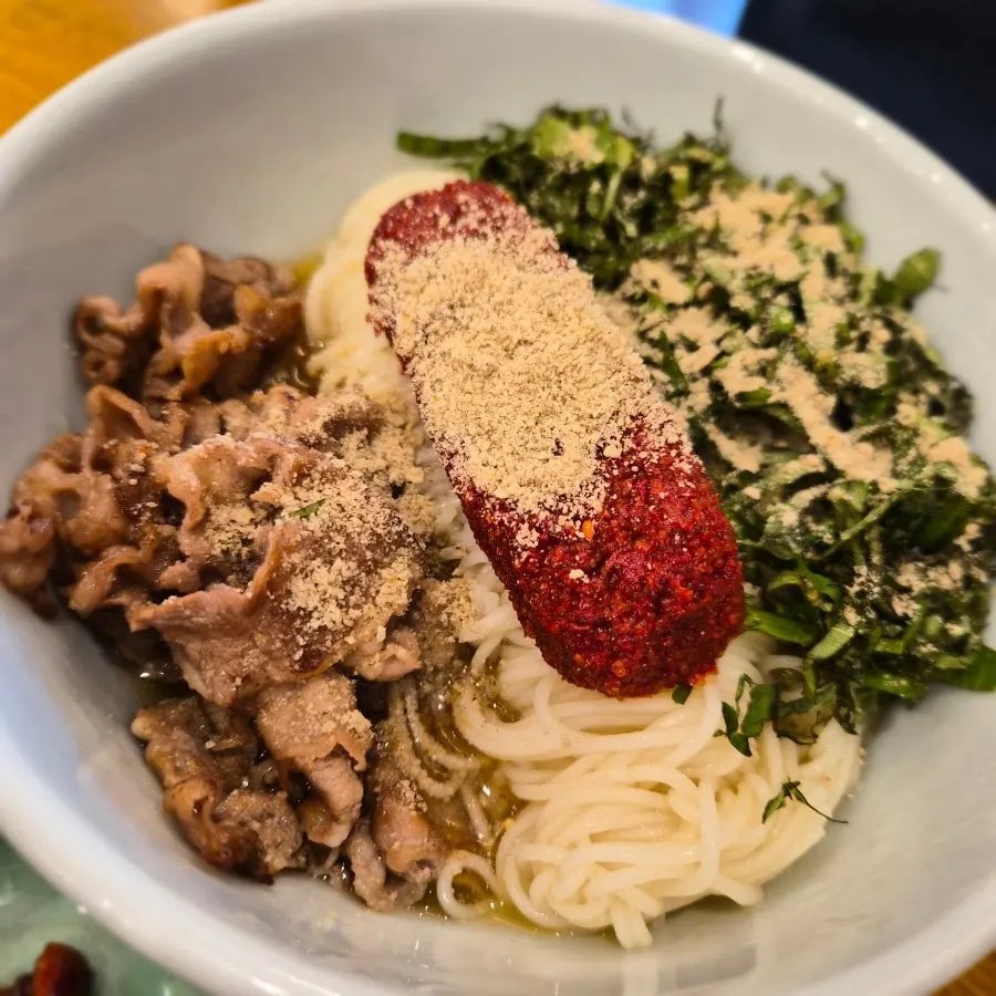 Herring roe bibim noodles topped with herring roe garnish