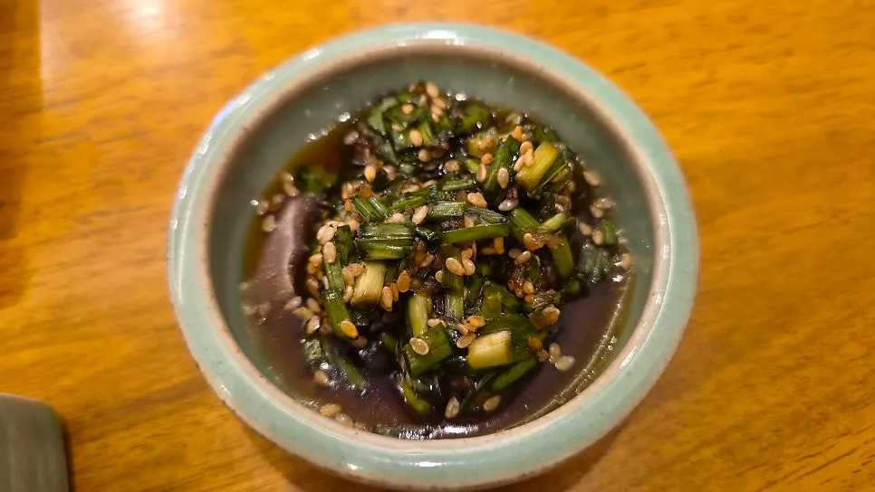 A bite of gim with rice and bibim jeotgal