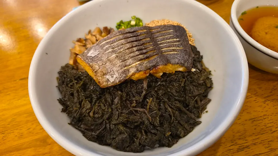 Grilled mackerel on top of thistle rice