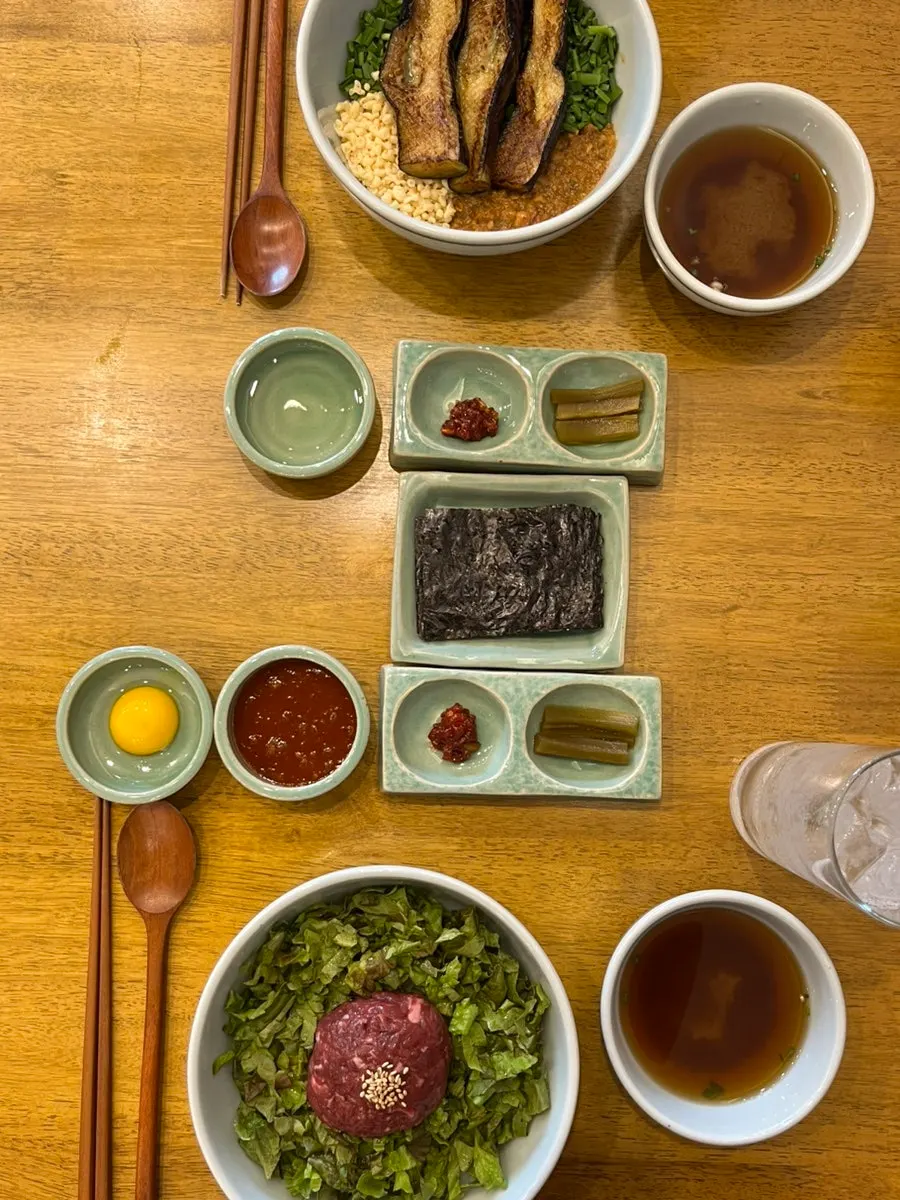 Mixed salted seafood, gopchang gim, and pickles as basic banchan
