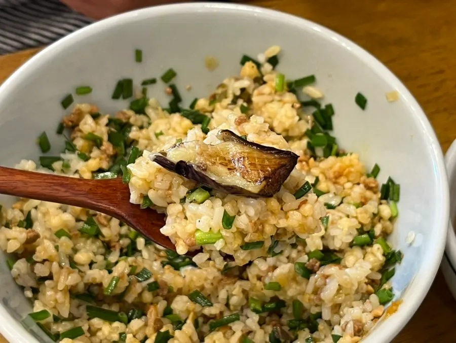 Eggplant miso rice bowl mixed with miso sauce and chives