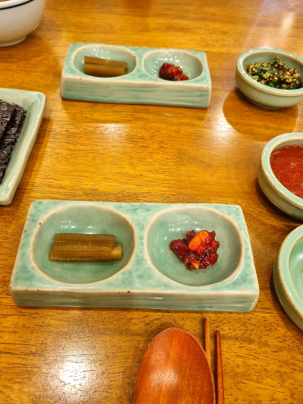 Table setting with egg yolk, soy sauce, and special sauce