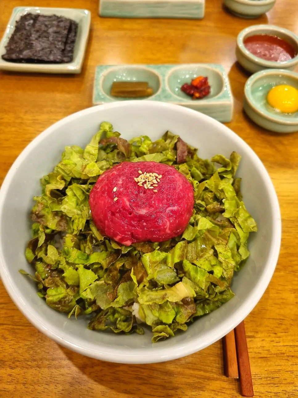 Yukhoe bibimbap piled high with raw beef at Hyangtaek Jeonpo Branch