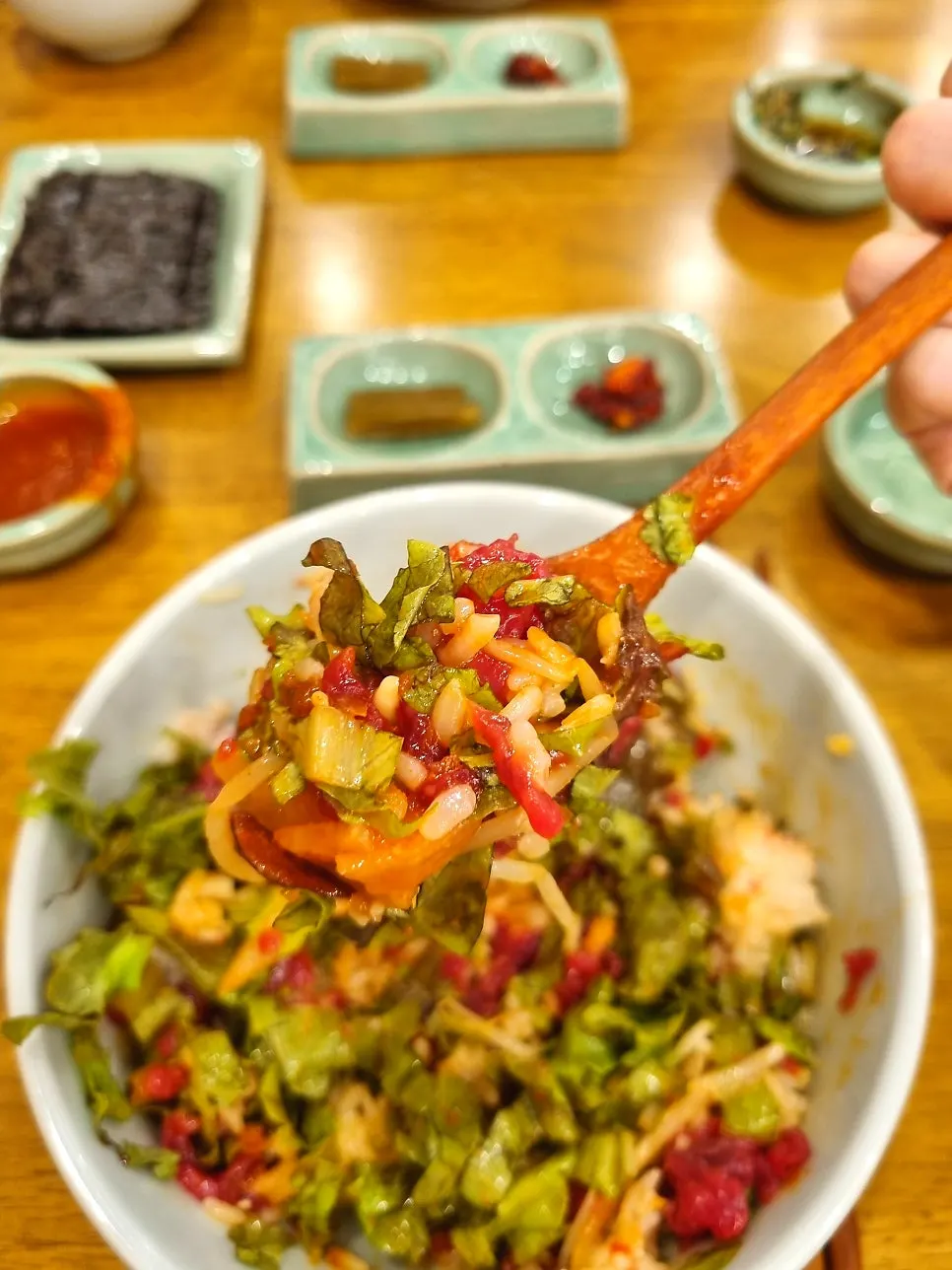 A spoonful of mixed yukhoe bibimbap