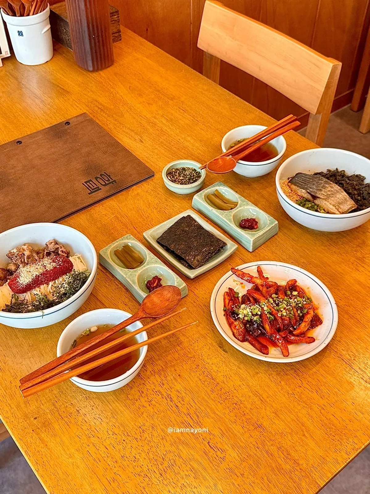 Full table with mackerel gondre rice, herring roe bibim noodles, and grilled deodeok mushrooms
