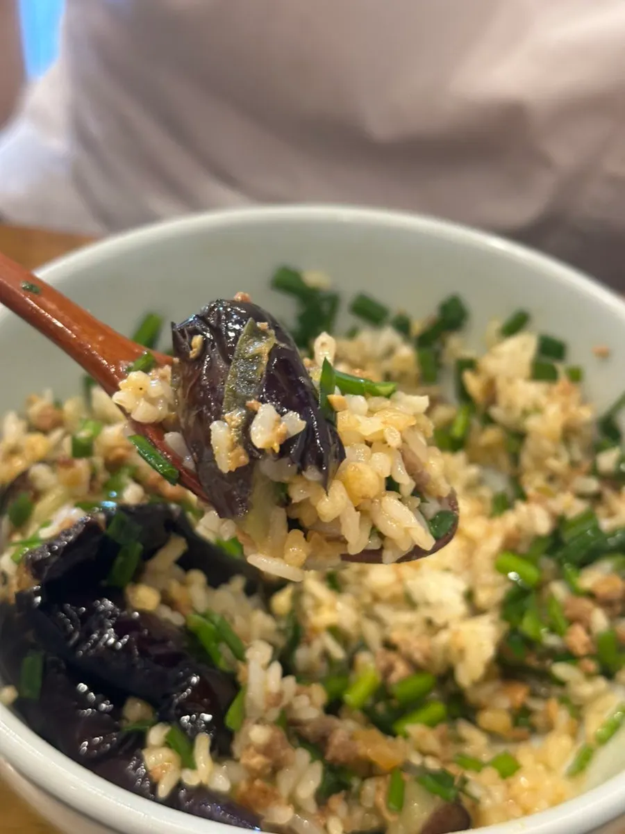 Large eggplant piece on top of the doenjang rice bowl