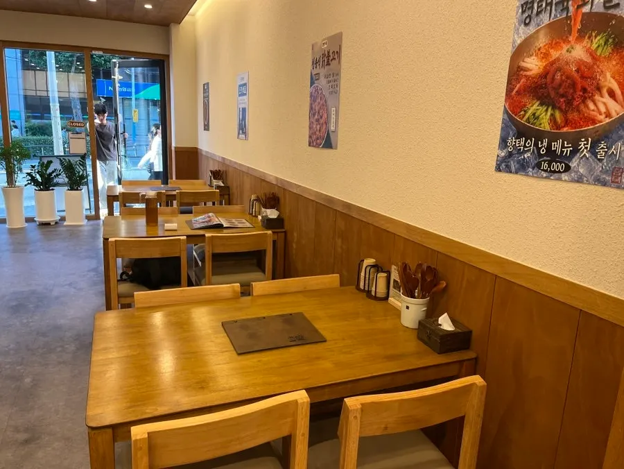Dining hall with tables for four at Hyangtaek Jeonpo Branch