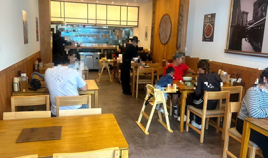 Interior of Hyangtaek Jeonpo Branch with wood-tone decor