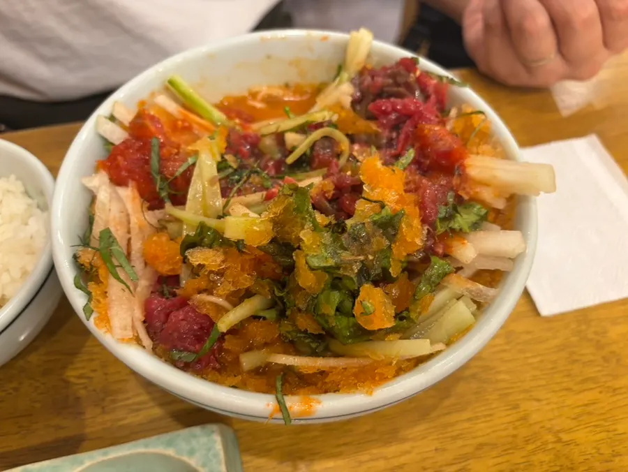 Mulhoe topped with raw beef, pollack, cucumber, and pear