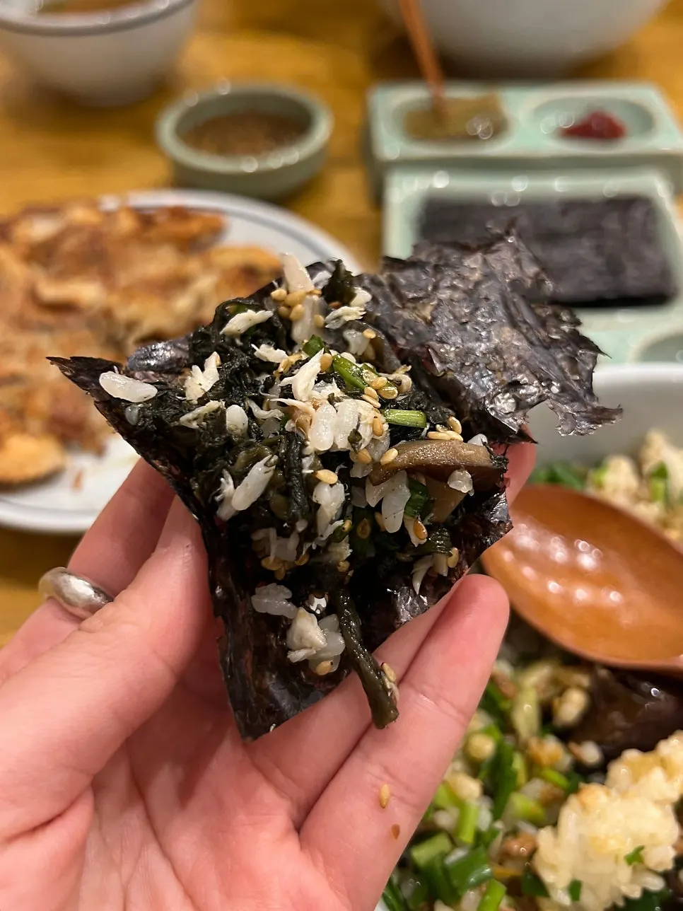 A spoonful of mackerel thistle rice mixed with sauce