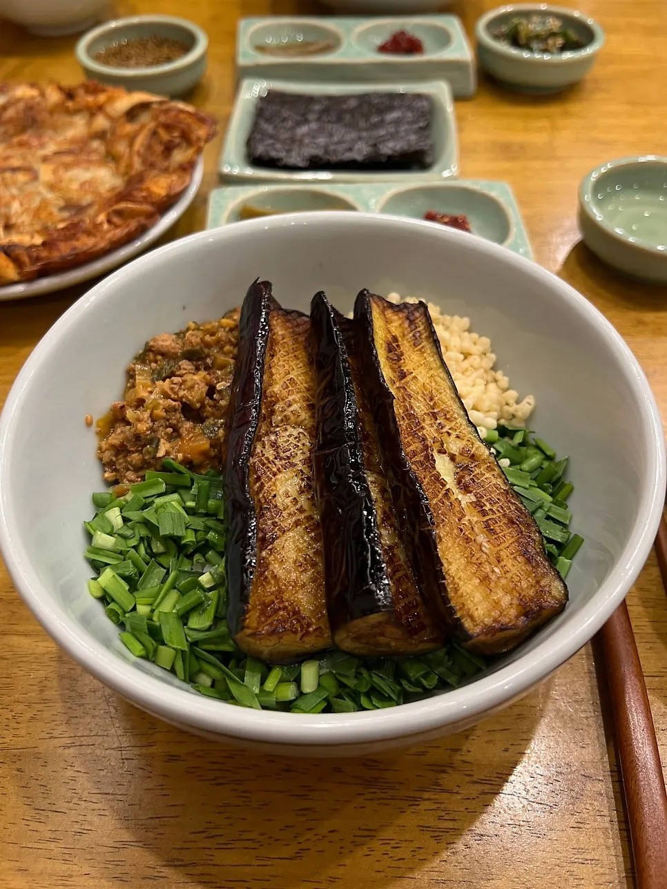 Table with the rice bowl, thistle rice, and mushroom pancake together